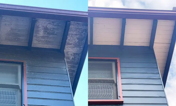 Dark weatherboard wall and eaves above a window, before and after a house wash: mould on the eaves lining on the left, clean on the right.