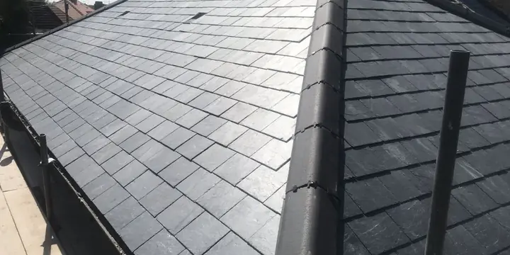 Slate tile roof and ridge after cleaning.