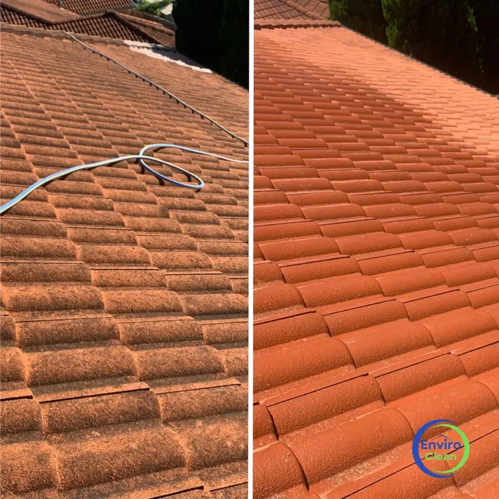 Terracotta-coloured concrete tile roof, before and after cleaning: dull with a hose across it on the left, clean on the right.